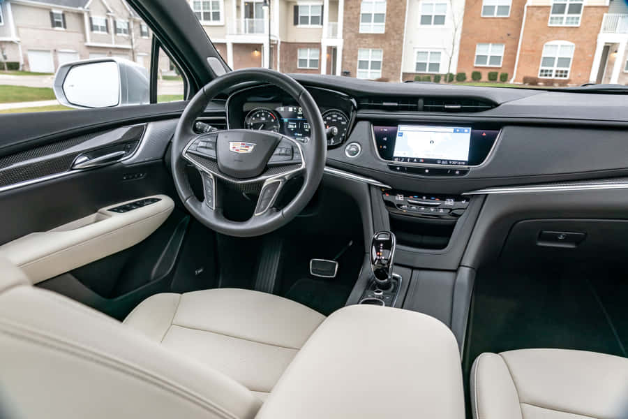 Luxury Red Cadillac Xt5 On The Road Wallpaper