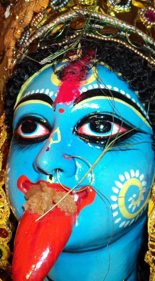 Maa Kali Blue Statue With Tongue Close-up Wallpaper