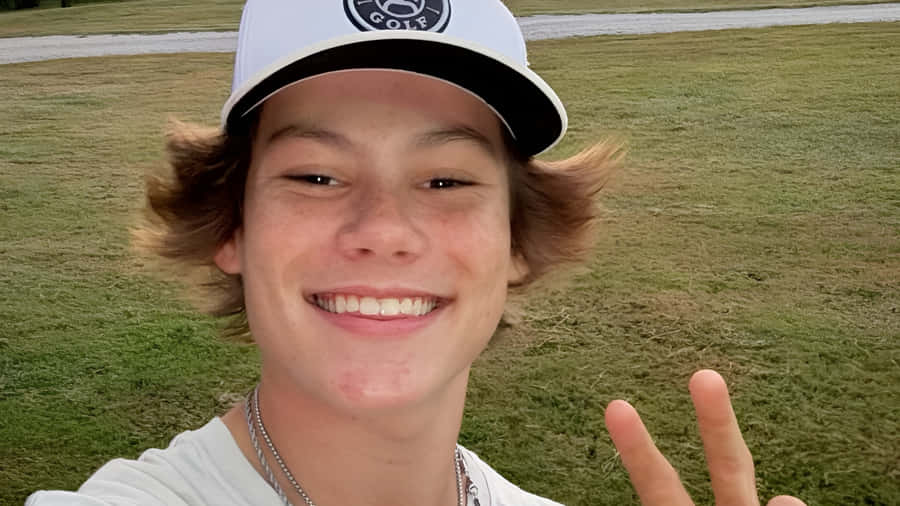 Maddox Batson Smiling Outdoors Wallpaper