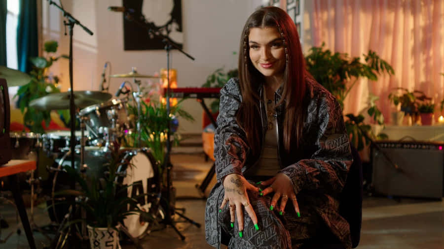 Mae Muller Performing Live On Stage Wallpaper