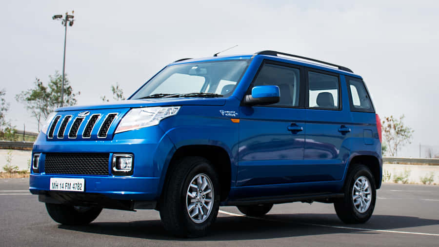 Mahindra T U V300 Blue S U V Side View Wallpaper
