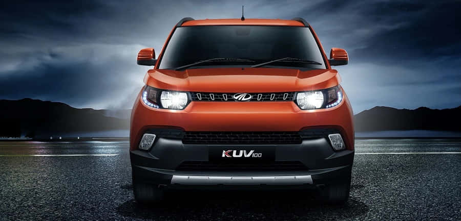 Mahindra Xuv500 On A Picturesque Mountain Road Wallpaper