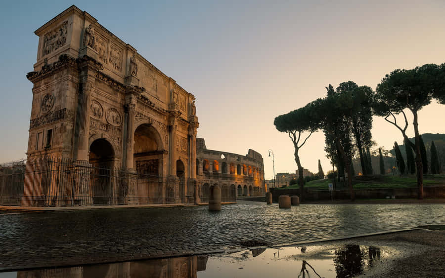 Majestic Arch Of Constantine On A Rain-soaked Day Wallpaper