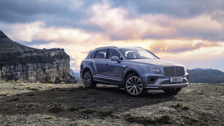 Majestic Bentley Bentayga In A Picturesque Landscape Wallpaper