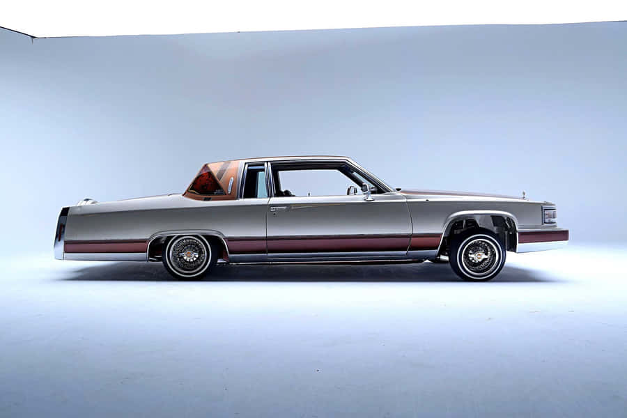 Majestic Cadillac Deville In Its Glory Wallpaper
