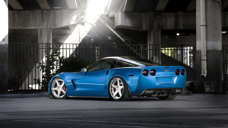 Majestic Chevrolet Corvette Zr1 Cruising On The Road Wallpaper