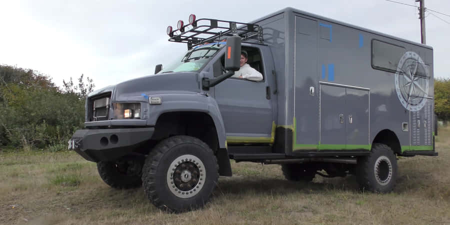 Majestic Gmc Topkick Truck Cruising Down The Highway Wallpaper