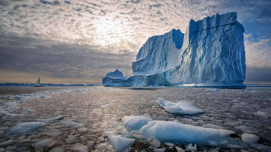 Majestic Iceberg On A Sunny Day Wallpaper