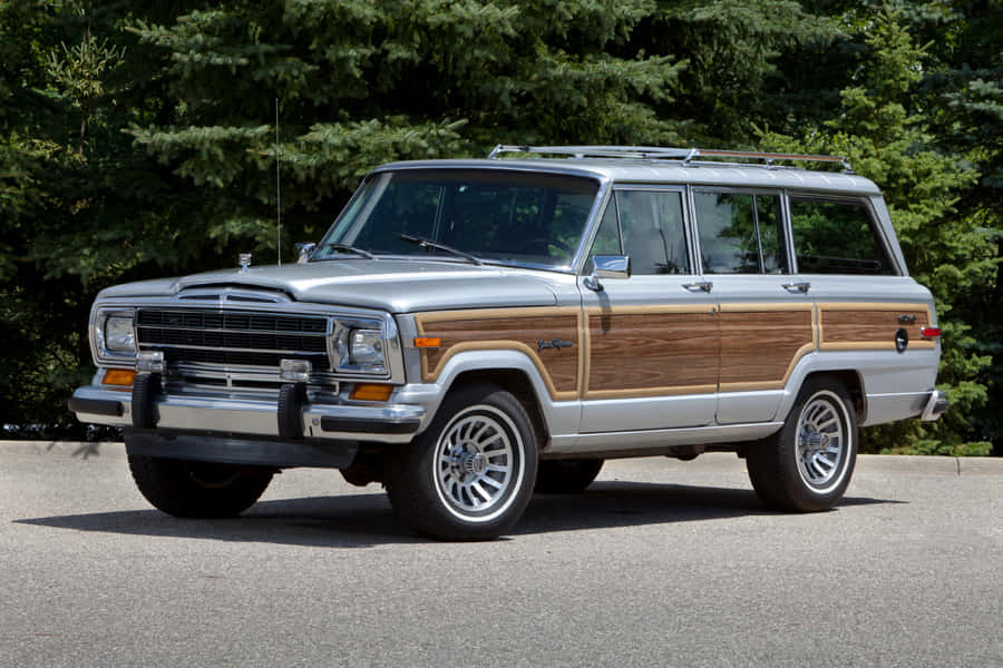 Majestic Jeep Wagoneer In Natural Setting Wallpaper