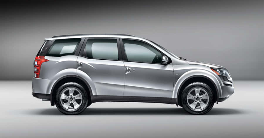 Majestic Mahindra Xuv500 Gliding Down The Highway Wallpaper