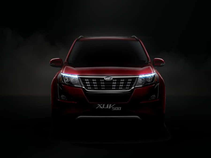 Majestic Mahindra Xuv500 In Natural Surroundings Wallpaper