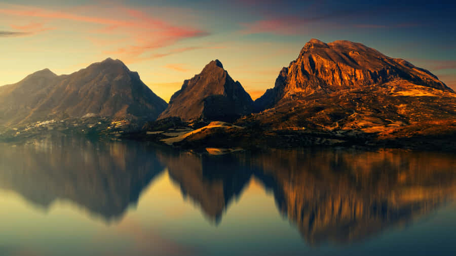 Majestic Mountains Reflected On Water Wallpaper
