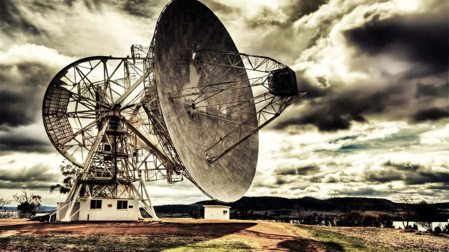 Majestic Radio Telescope Against The Starry Night Sky Wallpaper