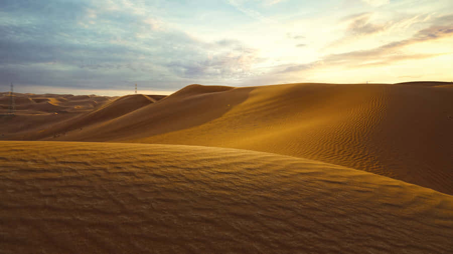 Majestic Sand Dunes At Sunset Wallpaper