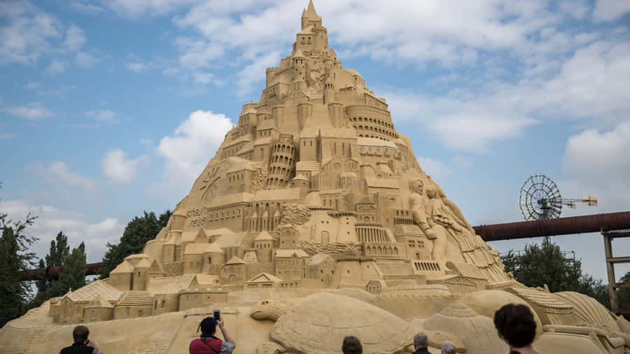 Majestic Sandcastle On A Sunny Beach Day Wallpaper
