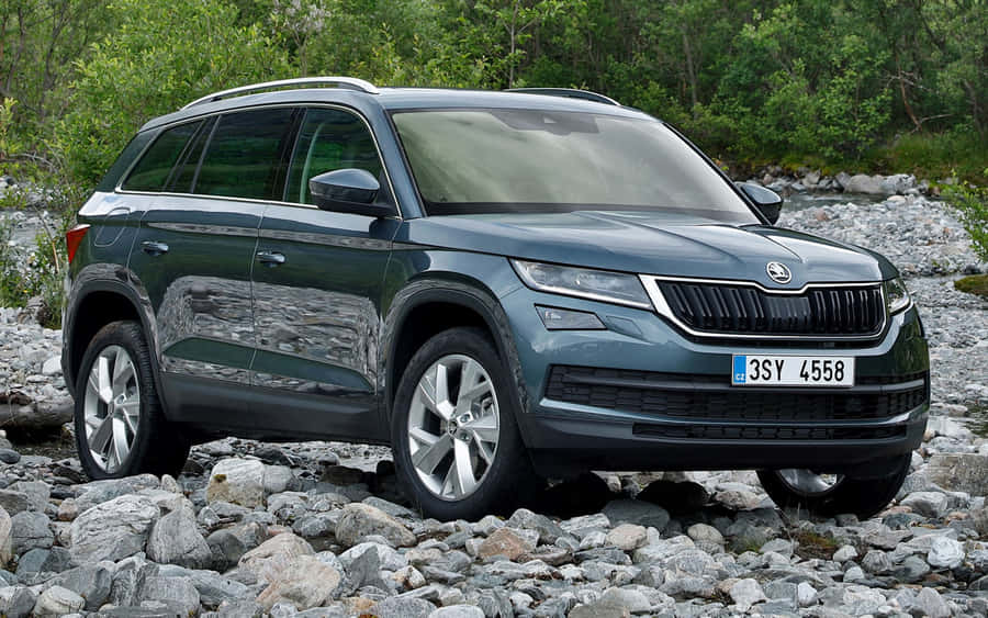 Majestic Skoda Kodiaq Cruising On A Highway Wallpaper