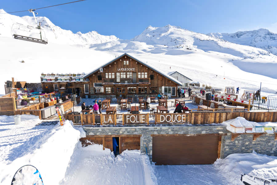 Majestic Snowy Ski Resort Landscape Wallpaper