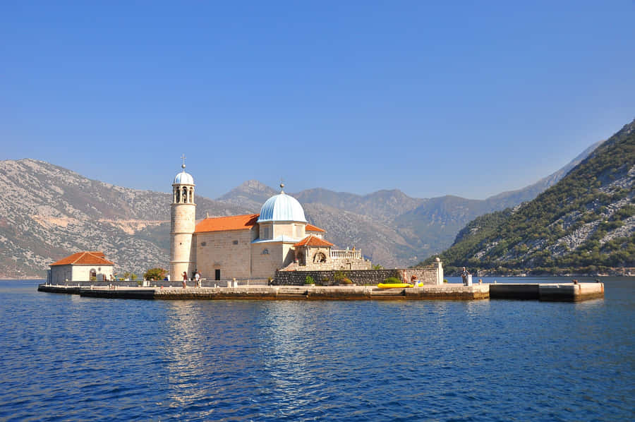 Majestic View Of Our Lady Of The Rocks In Montenegro Wallpaper