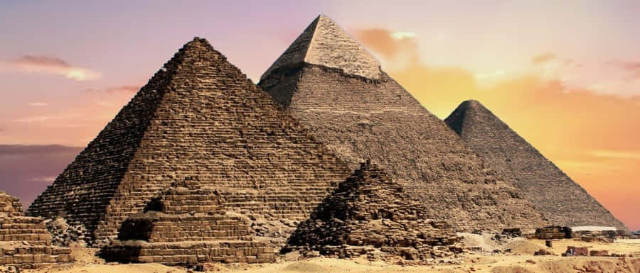 Majestic View Of The Ancient Giza Pyramids In Egypt Wallpaper