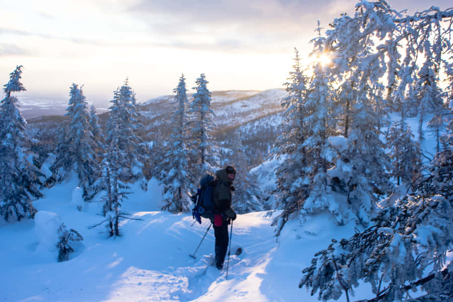 Majestic View Of The Saguenay Fjord At Sunset Wallpaper