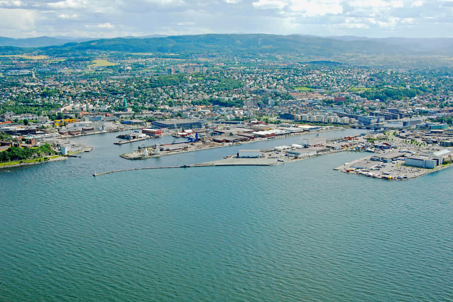 Majestic View Of Trondheim Cityscape At Sunset Wallpaper