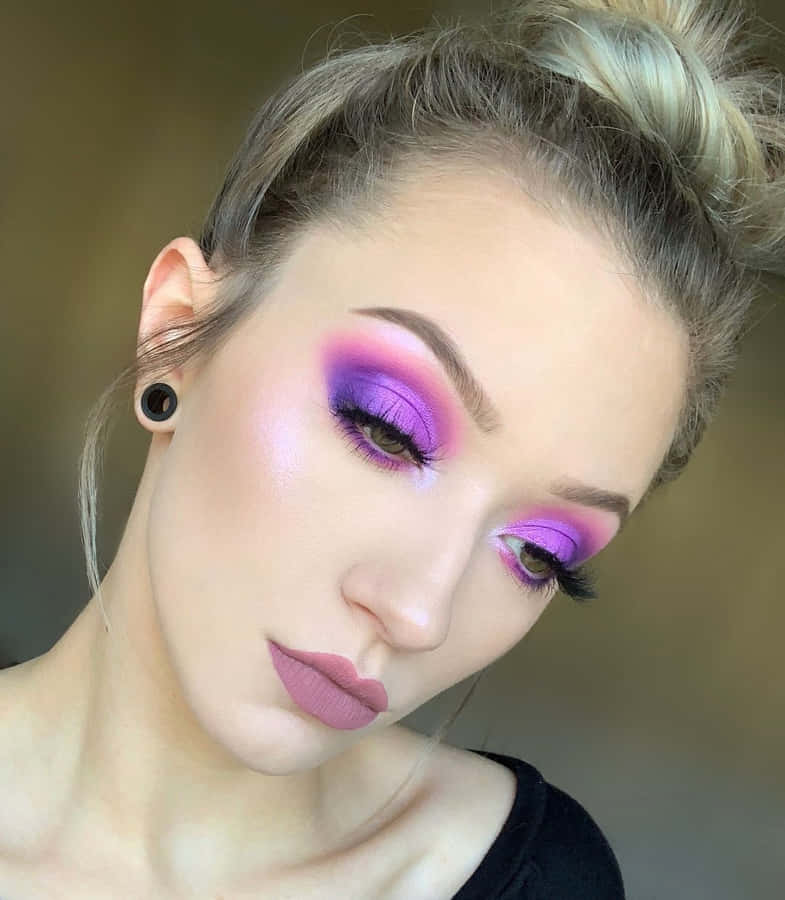 Make A Statement With A Vibrant Purple Eye Shadow Look Wallpaper