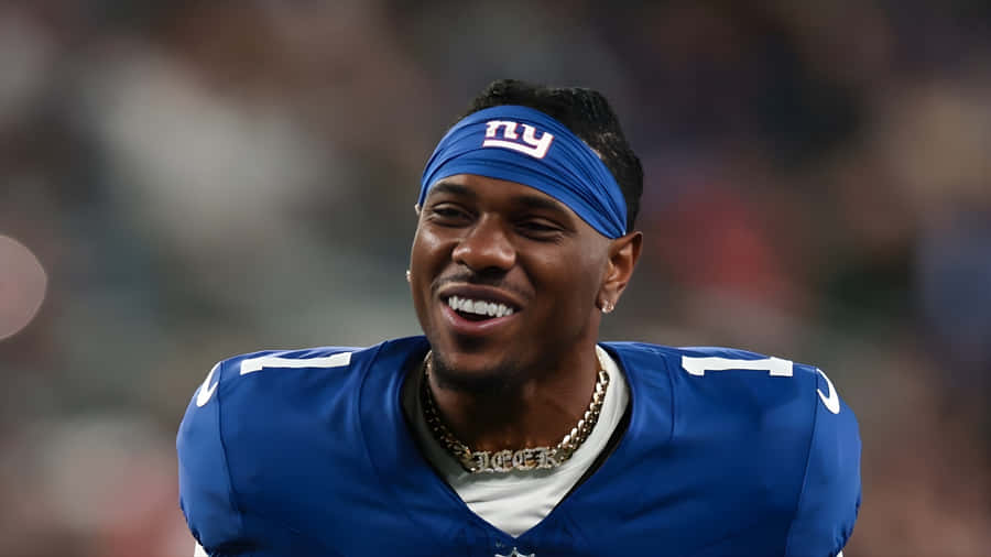 Malik Nabers Smiling In Giants Jersey Wallpaper