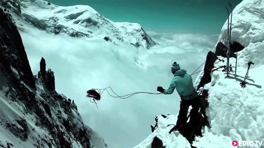Man With Long Rope Of Steep Mountain Wallpaper