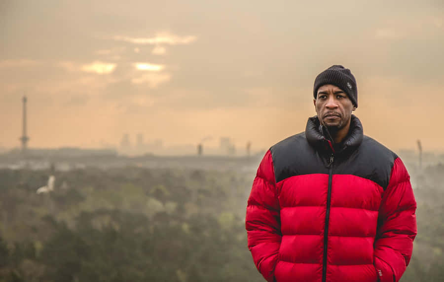 Manin Red Jacketwith City Skyline Wallpaper