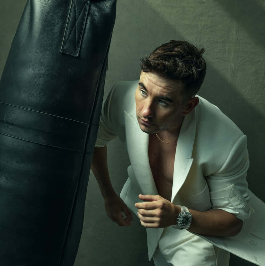 Manin White Blazer Leaningon Boxing Bag Wallpaper