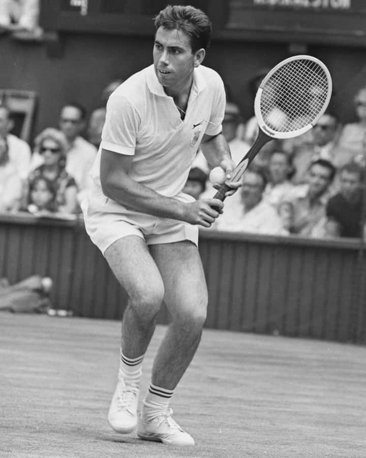 Manuel Santana Holding His Racket In Ready Position Wallpaper