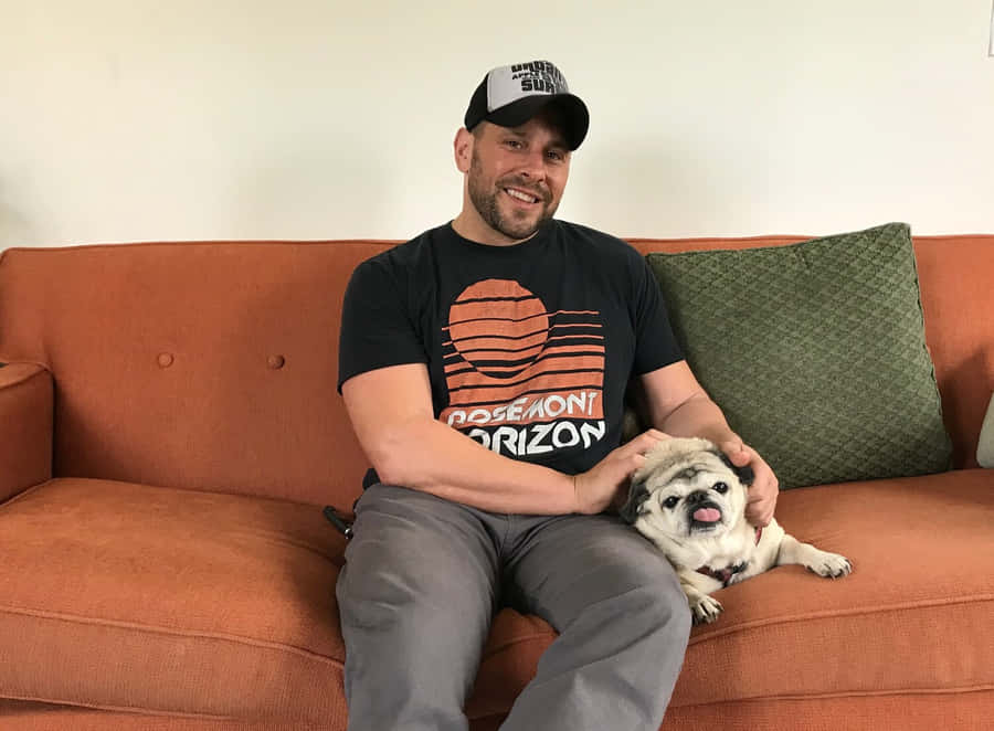 Manwith Pugon Orange Couch Wallpaper