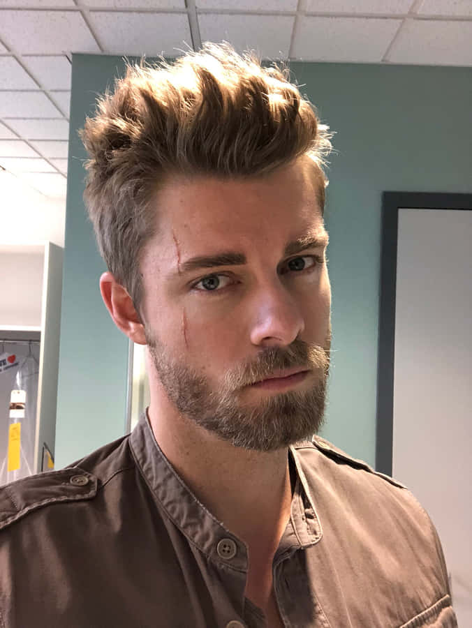 Manwith Scruffy Beardand Bruised Face.jpg Wallpaper