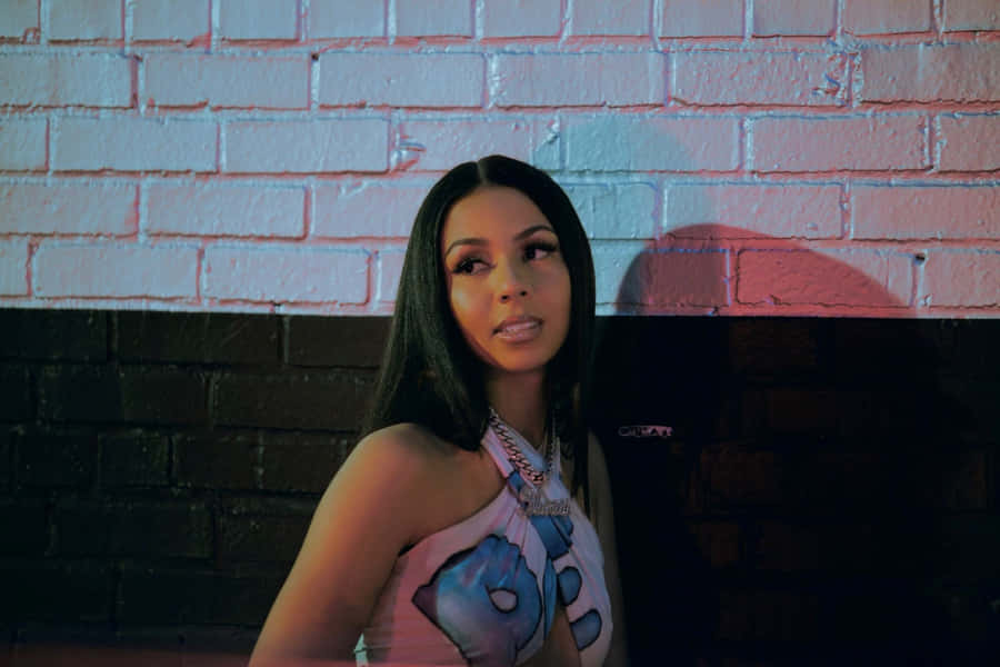 Mariah The Scientist Against Brick Wall Wallpaper