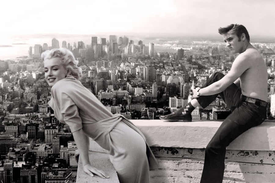 Marilyn Monroe And John Lennon On The Top Of A Building Wallpaper