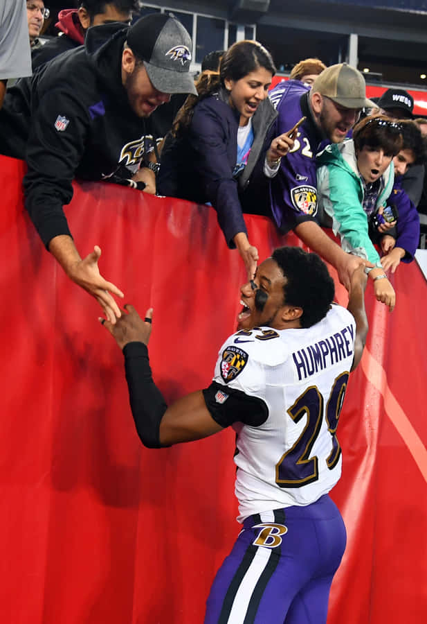 Marlon Humphrey Celebratingwith Fans Wallpaper