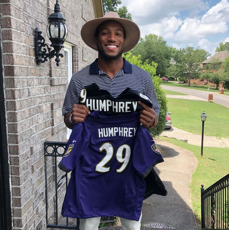 Marlon Humphrey Holding Football Jersey Wallpaper