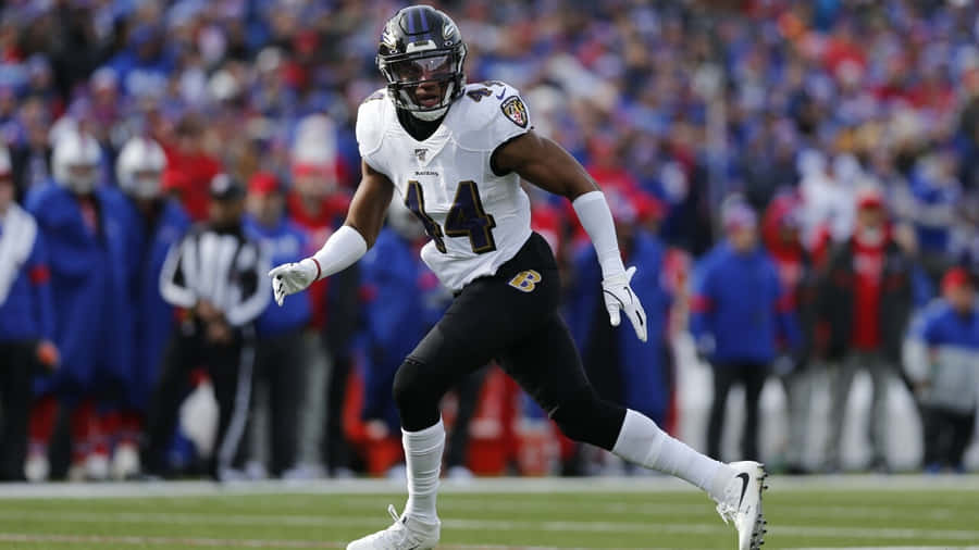 Marlon Humphrey In Action Baltimore Ravens Wallpaper
