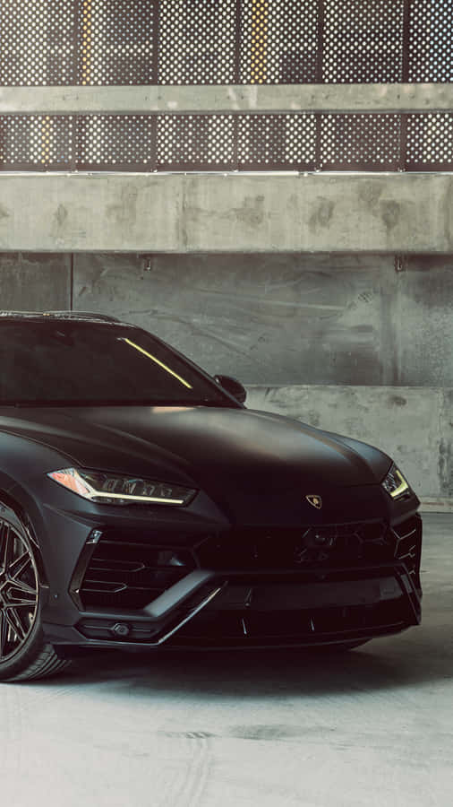 Matte Black Luxury Car Urban Backdrop Wallpaper