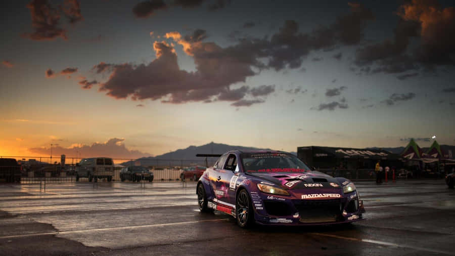 Mazda Rx-8 Sporty Red Coupe On A Scenic Road Wallpaper