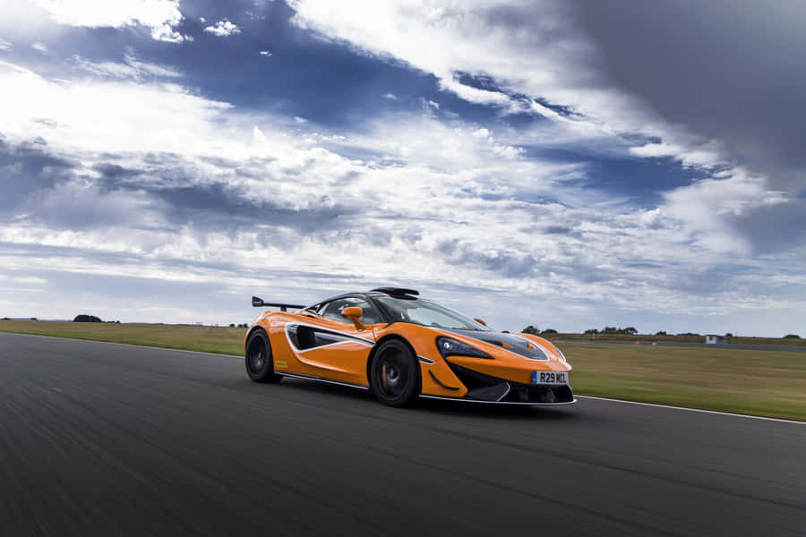 Mclaren 620r - Unleashing The Power Of Luxury Wallpaper
