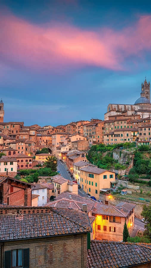 Medieval Houses Dotting The Landscape In Siena Wallpaper