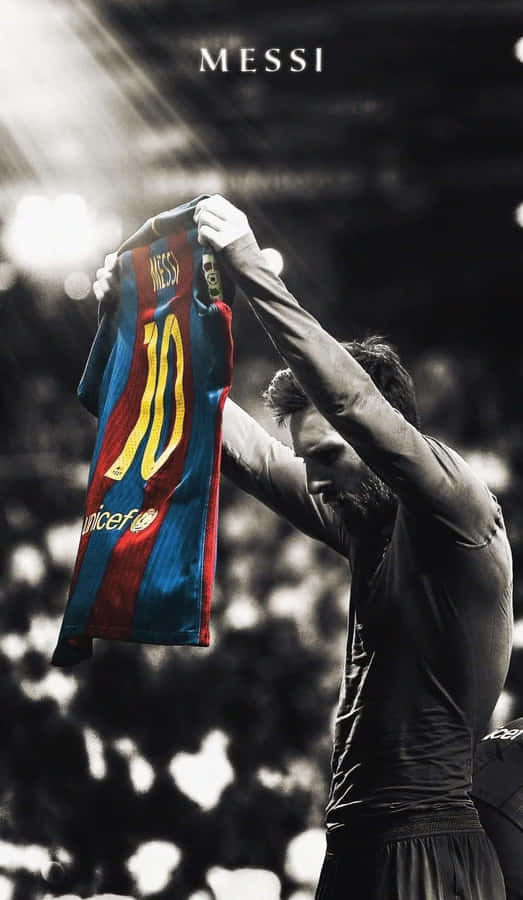 Messi Holding Barcelona Jersey Wallpaper