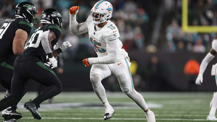 Miami Dolphins Playerin Action Against New York Jets Wallpaper