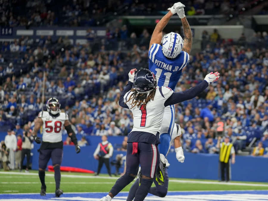 Michael Pittman Jr Catching Football During Game Wallpaper