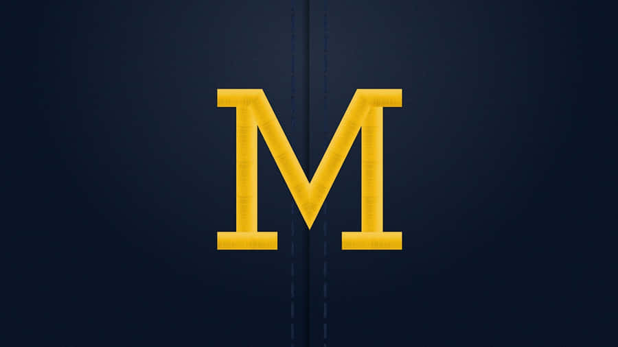Michigan Wolverines Logo On A Football Field Wallpaper