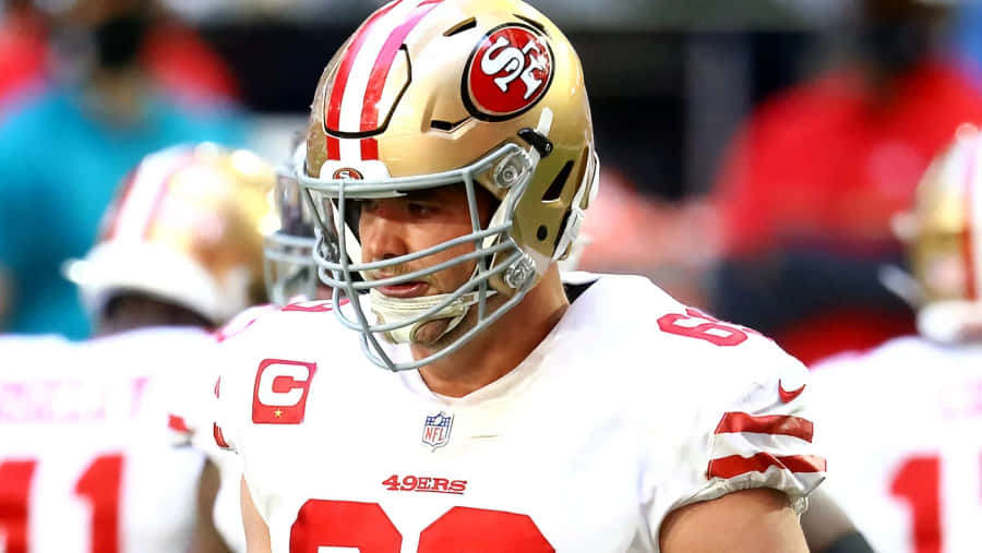 Mike Mcglinchey In Action During A Football Game Wallpaper