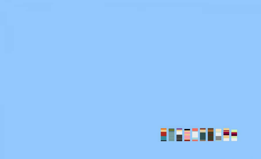 Minimalist Macbook Setup Blue Background Wallpaper