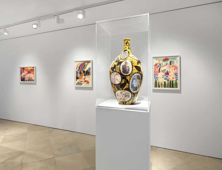 Modern Art Gallery Exhibit Vaseand Paintings Wallpaper