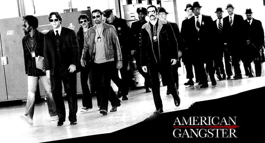 Modern Gang Members With Leader In Urban Setting Wallpaper